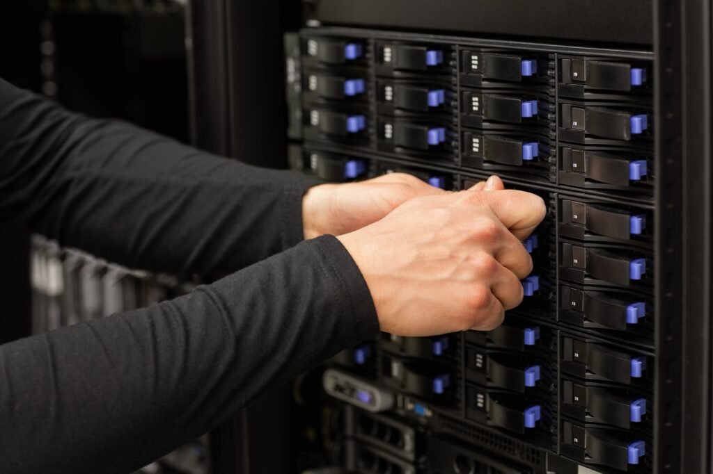 Technical Consultant Adjusting Hard Drives Stack In SAN At Datac